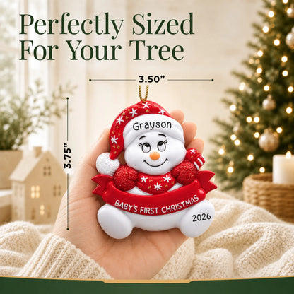 Size guide: the personalized red baby's 1st christmas snowman ornament is 3.50 in wide by 3.75 in tall, shown in hand
