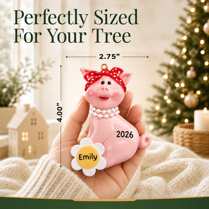 Size guide: the personalized little piggy christmas ornament is 2.75 in wide by 4.00 in tall, shown in hand
