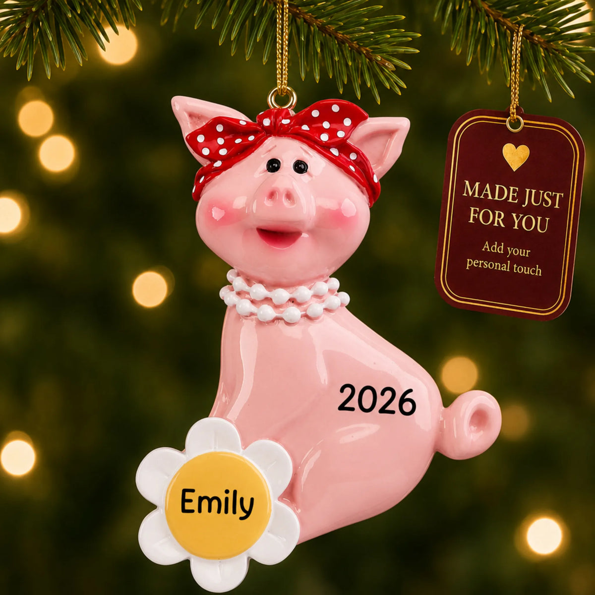 Little piggy christmas ornament hanging on a lit Christmas tree with a Made Just For You gift tag
