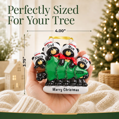 Personalized black bear family of 4 Christmas ornament held in hand, about 4 inches wide for your tree