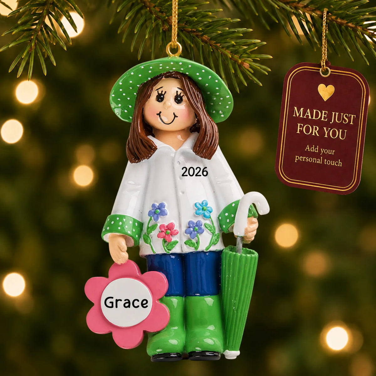 Gardening christmas ornament hanging on a lit Christmas tree with a Made Just For You gift tag