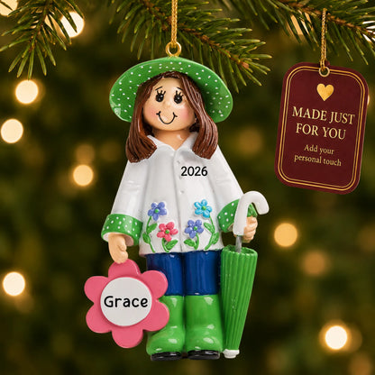 Gardening christmas ornament hanging on a lit Christmas tree with a Made Just For You gift tag