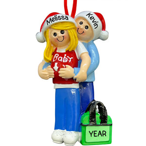 Personalized blonde expecting couple ornament with a baby bump, hand-lettered with names and date