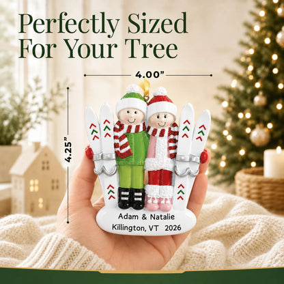 Size guide: the personalized ski couple christmas ornament is 4.00 in wide by 4.25 in tall, shown in hand