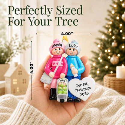 Size guide: the personalized our new family christmas ornament is 4.00 in wide by 4.00 in tall, shown in hand