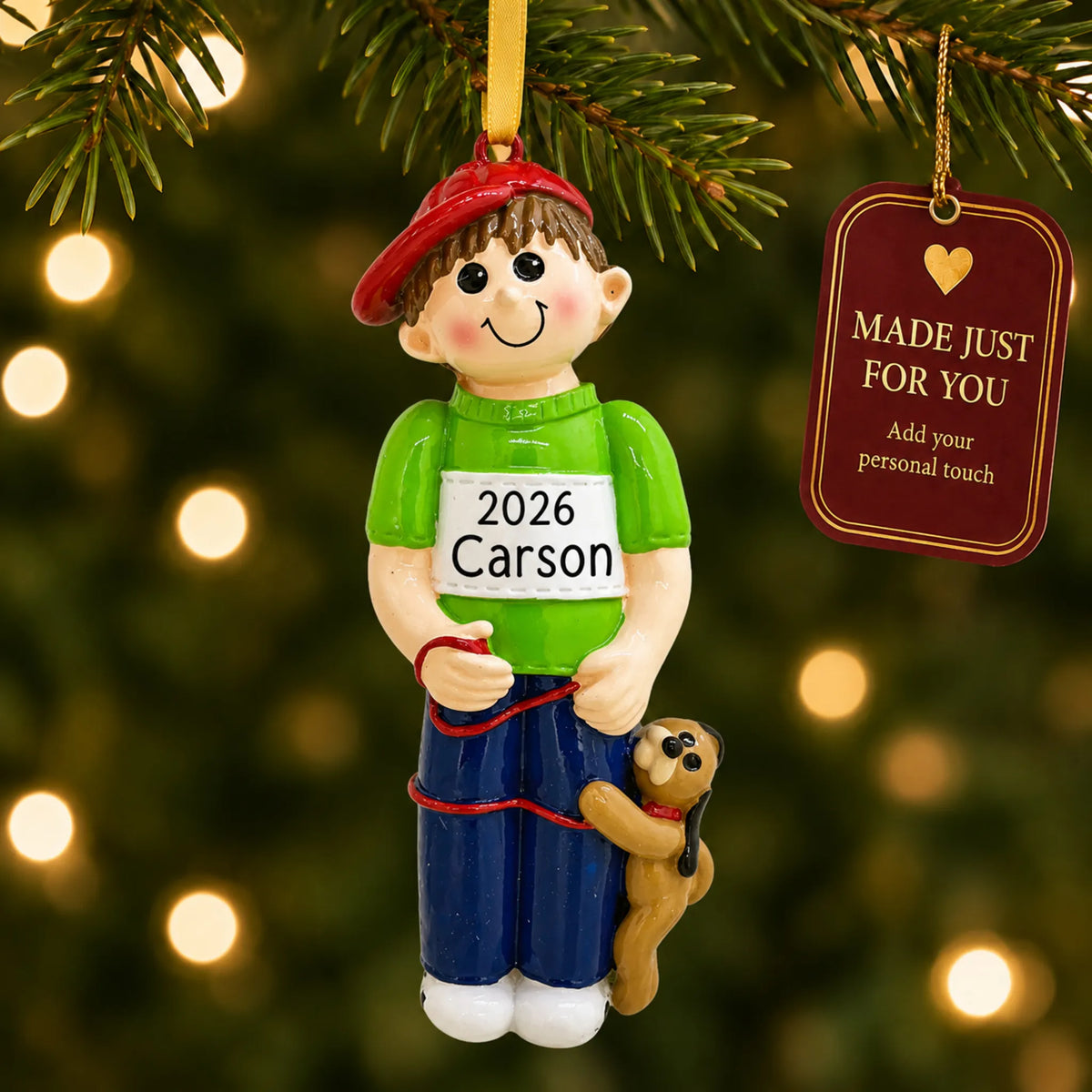 Boy With Dog christmas ornament hanging on a lit Christmas tree with a Made Just For You gift tag