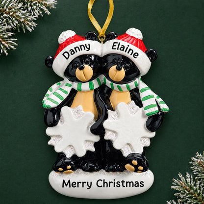 Personalized black bear couple christmas ornament on a dark green pine background