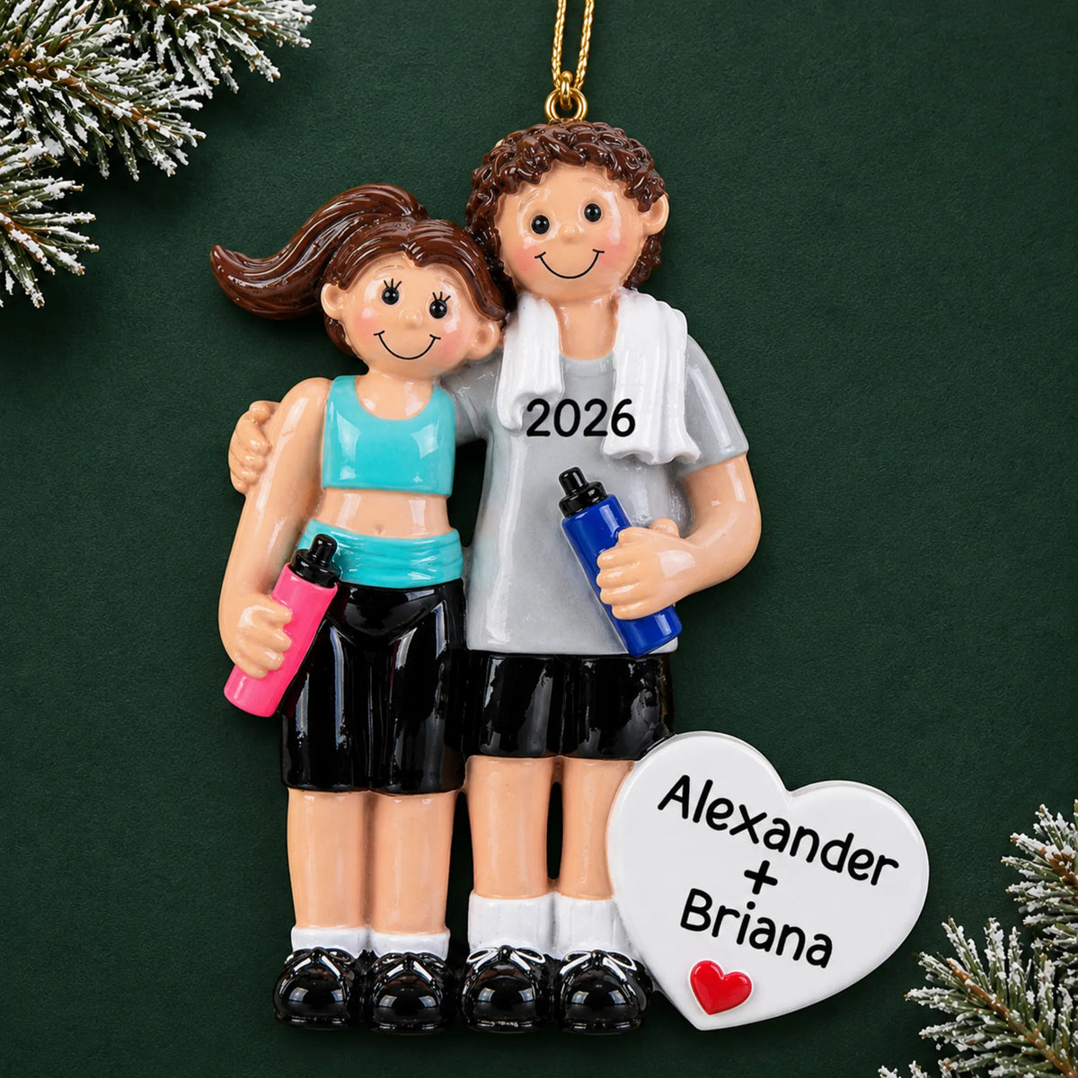 Personalized workout couple christmas ornament on a dark green pine background