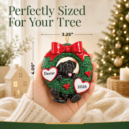 Size guide: the personalized Black Lab Glitter Wreath christmas ornament is 3.25 in wide by 4.00 in tall, shown in hand