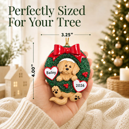 Size guide: the personalized Golden Retriever Glitter Wreath christmas ornament is 3.25 in wide by 4.00 in tall, shown in hand