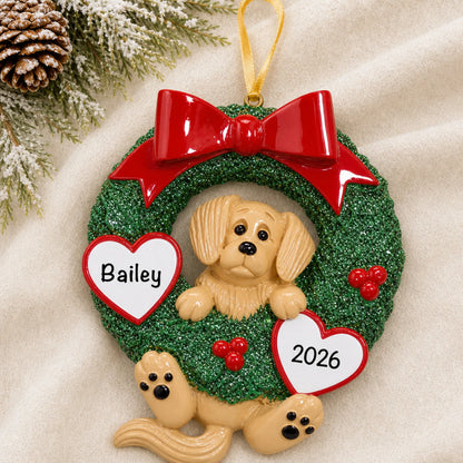 Personalized Golden Retriever Glitter Wreath christmas ornament laid on a soft white knit blanket
