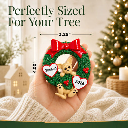 Size guide: the personalized Chihuahua Glitter Wreath christmas ornament is 3.25 in wide by 4.00 in tall, shown in hand