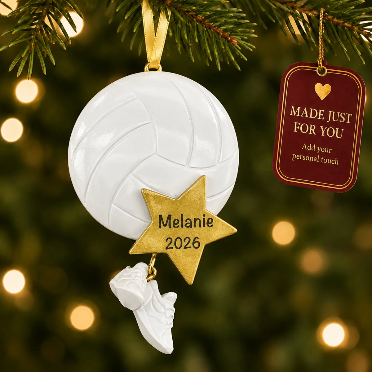 Volleyball star christmas ornament hanging on a lit Christmas tree with a Made Just For You gift tag
