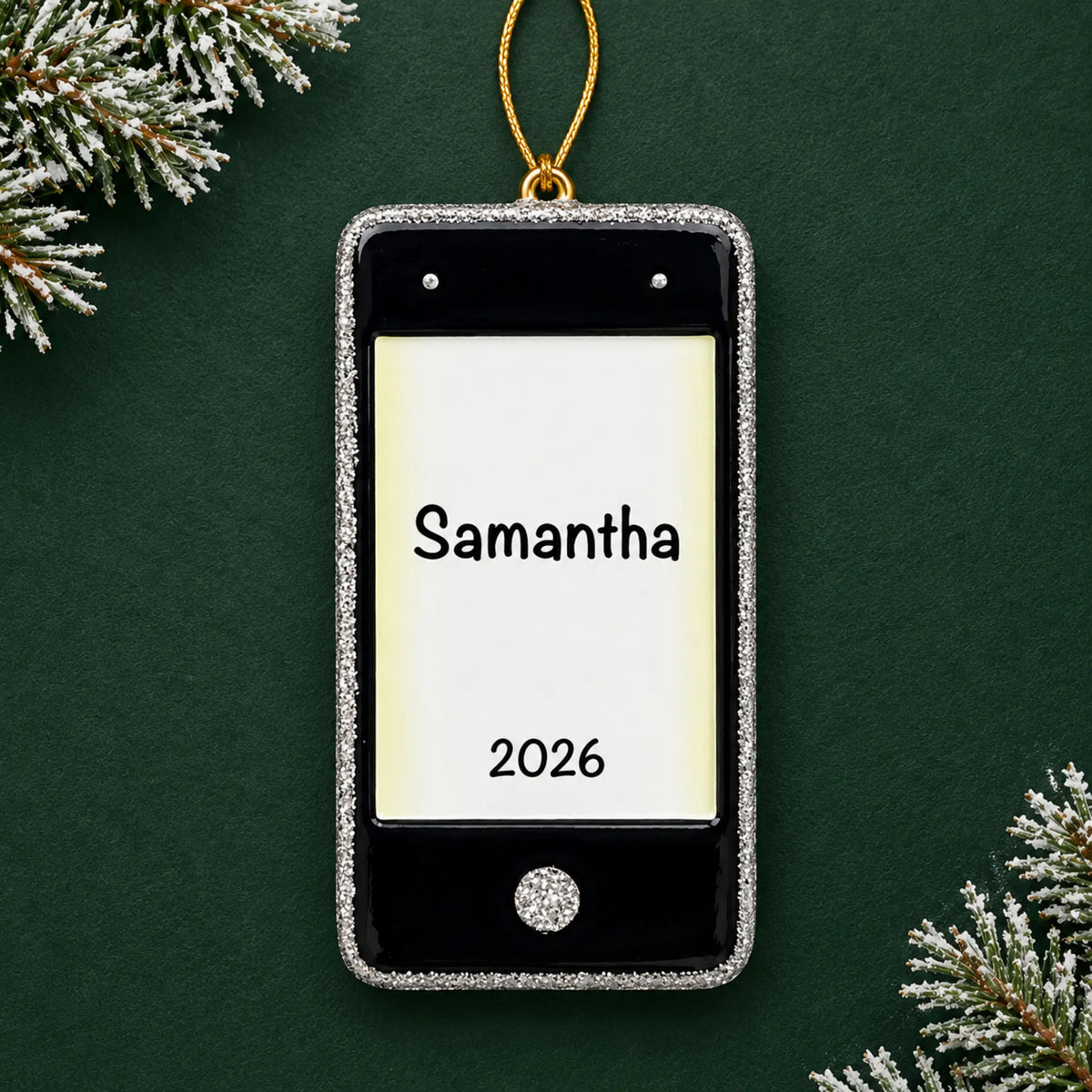 Personalized cell phone christmas ornament on a dark green pine background