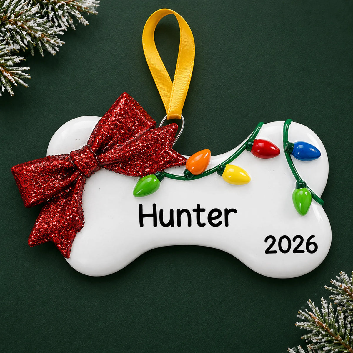 Personalized Holiday Lights Dog Bone christmas ornament on a dark green pine background