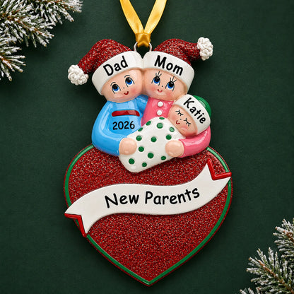 Personalized new parents christmas ornament on a dark green pine background
