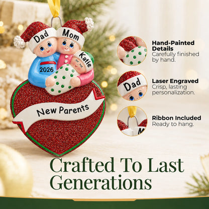 Hand-painted details and laser engraved personalization on the new parents christmas ornament, ribbon included
