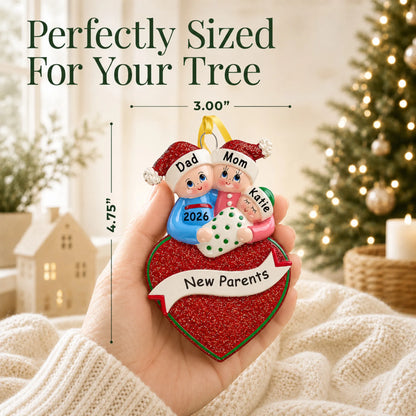Size guide: the personalized new parents christmas ornament is 3.00 in wide by 4.75 in tall, shown in hand