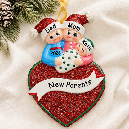 Personalized new parents christmas ornament laid on a soft white knit blanket