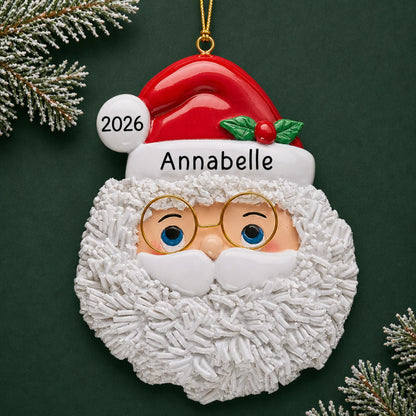 Personalized Santa Claus christmas ornament on a dark green pine background
