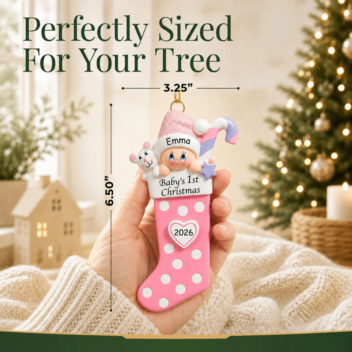 Size guide: the personalized pink baby's 1st christmas stocking ornament is 3.25 in wide by 6.50 in tall, shown in hand