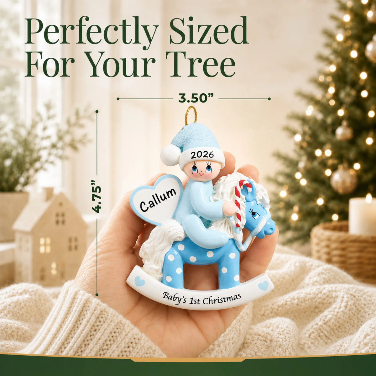 Size guide: the personalized blue baby's 1st christmas rocking horse ornament is 3.50 in wide by 4.75 in tall, shown in hand