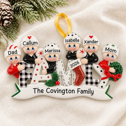 Personalized plaid family of 6 christmas ornament laid on a soft white knit blanket