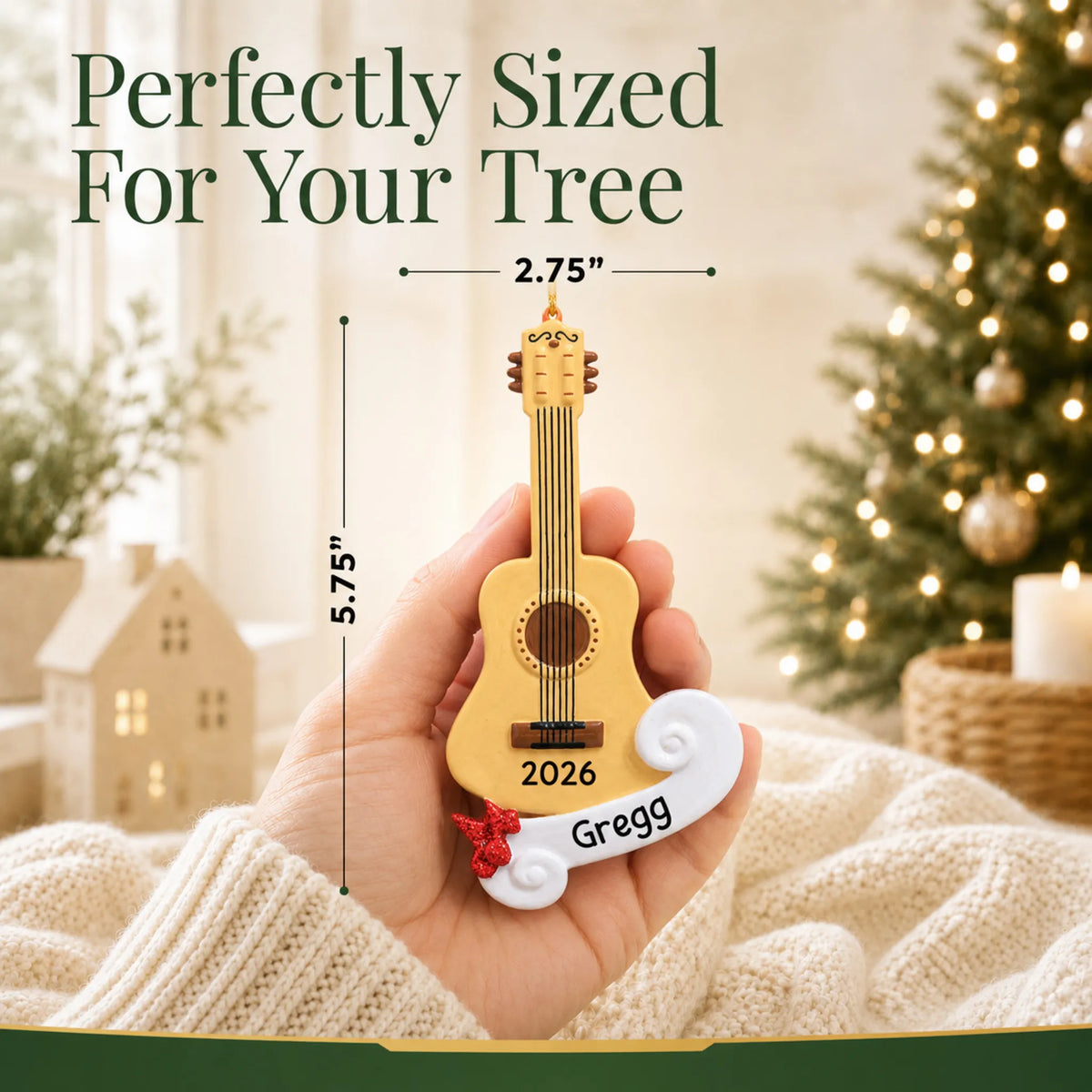 Size guide: the personalized acoustic guitar christmas ornament is 2.75 in wide by 5.75 in tall, shown in hand