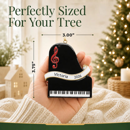 Size guide: the personalized grand piano christmas ornament is 3.00 in wide by 3.75 in tall, shown in hand
