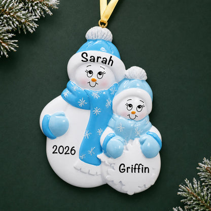 Personalized single parent snowman with 1 child christmas ornament on a dark green pine background