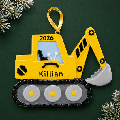 Personalized excavator christmas ornament on a dark green pine background