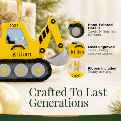 Hand-painted details and laser engraved personalization on the excavator christmas ornament, ribbon included