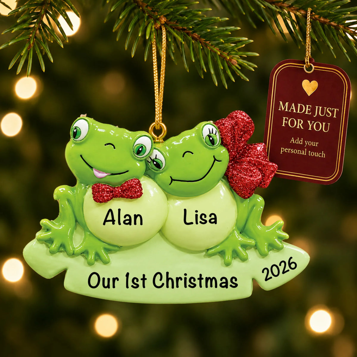 Frog couple christmas ornament hanging on a lit Christmas tree with a Made Just For You gift tag