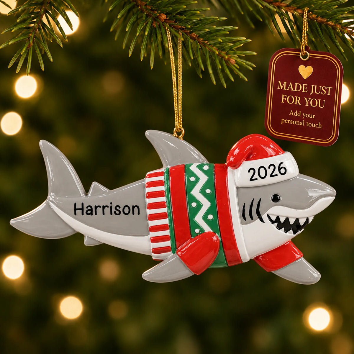 Shark fun christmas ornament hanging on a lit Christmas tree with a Made Just For You gift tag