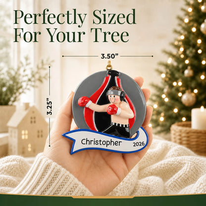 Size guide: the personalized boxing guy christmas ornament shown in hand next to a Christmas tree