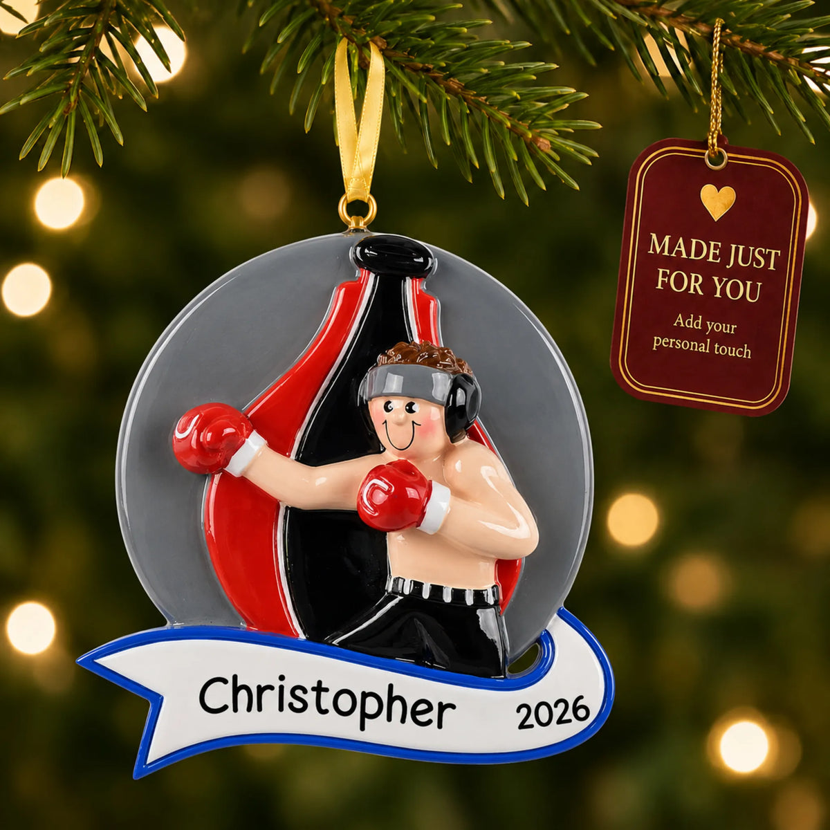 Boxing guy christmas ornament hanging on a lit Christmas tree with a Made Just For You gift tag