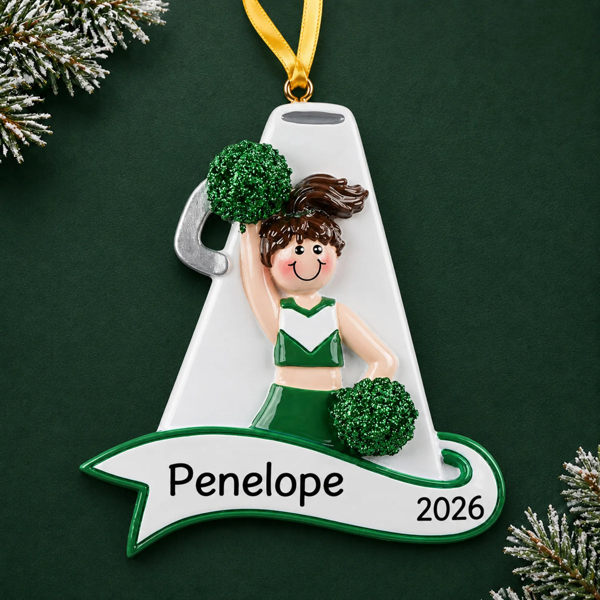 Personalized cheerleader green megaphone christmas ornament on a dark green pine background