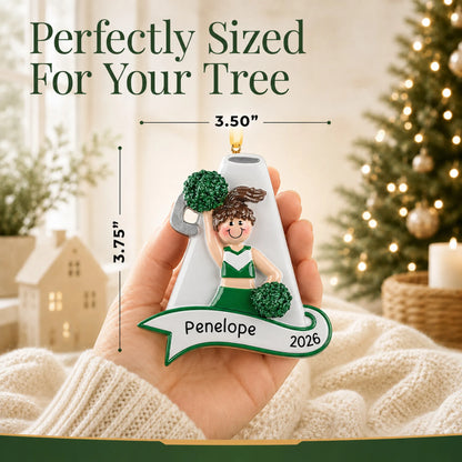 Size guide: the personalized cheerleader green megaphone christmas ornament is 3.50 in wide by 3.75 in tall, shown in hand