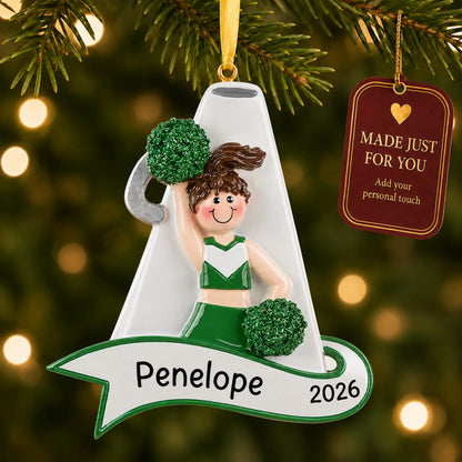 Cheerleader green megaphone christmas ornament hanging on a lit Christmas tree with a Made Just For You gift tag