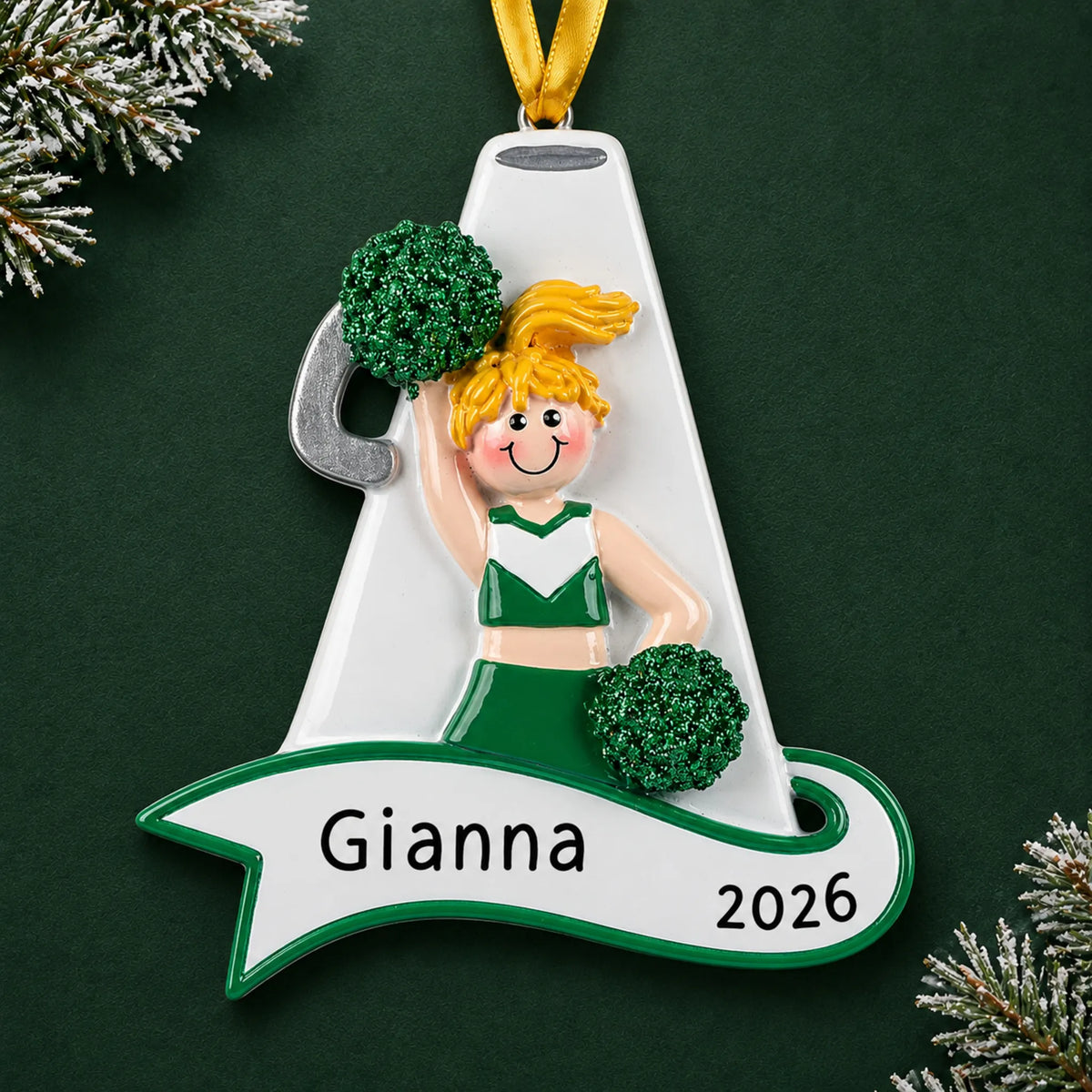 Personalized blonde cheerleader green megaphone christmas ornament on a dark green pine background