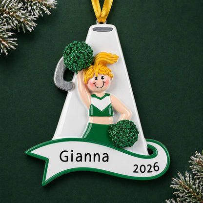 Personalized blonde cheerleader green megaphone christmas ornament on a dark green pine background
