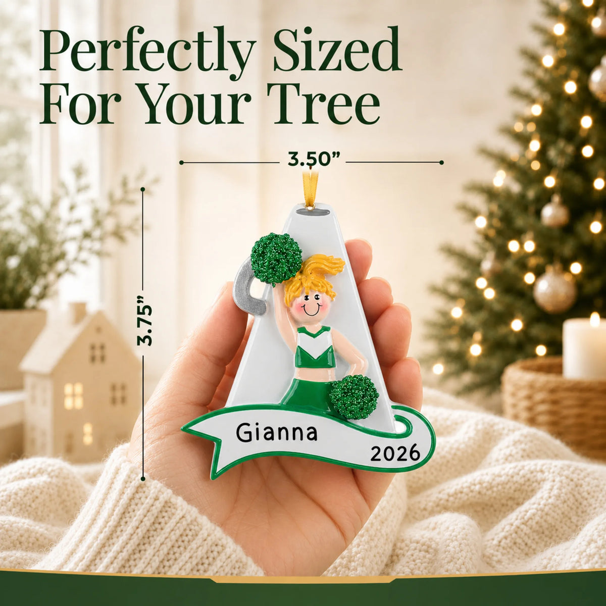 Size guide: the personalized blonde cheerleader green megaphone christmas ornament shown in hand next to a Christmas tree