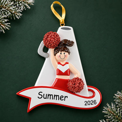 Personalized cheerleader red megaphone christmas ornament on a dark green pine background