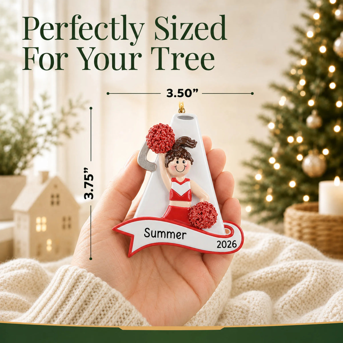 Size guide: the personalized cheerleader red megaphone christmas ornament is 3.50 in wide by 3.75 in tall, shown in hand