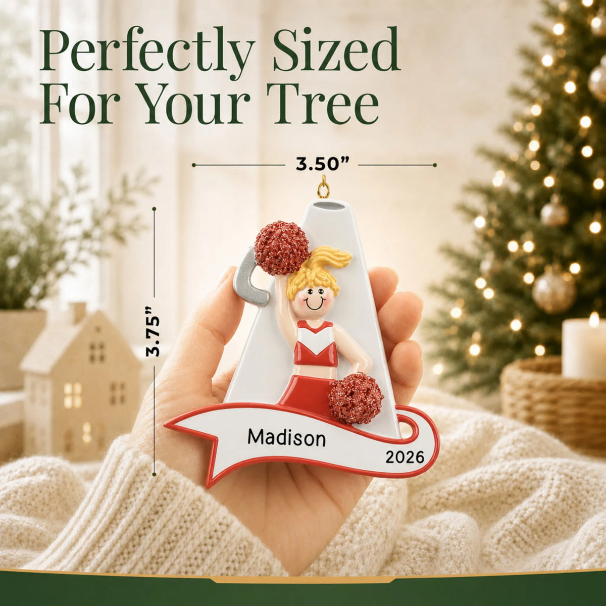 Size guide: the personalized blonde cheerleader red megaphone christmas ornament shown in hand next to a Christmas tree