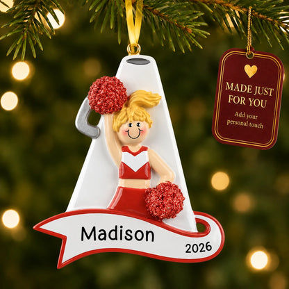 Blonde cheerleader red megaphone christmas ornament hanging on a lit Christmas tree with a Made Just For You gift tag
