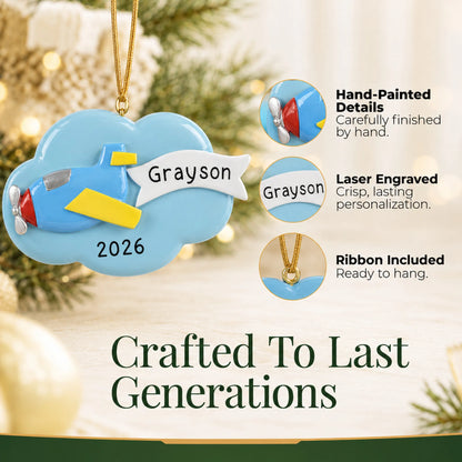 Hand-painted details and laser engraved personalization on the airplane christmas ornament, ribbon included