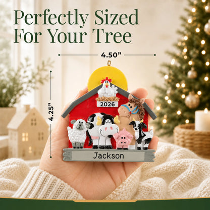 Size guide: the personalized farm animals barn christmas ornament is 4.50 in wide by 4.25 in tall, shown in hand