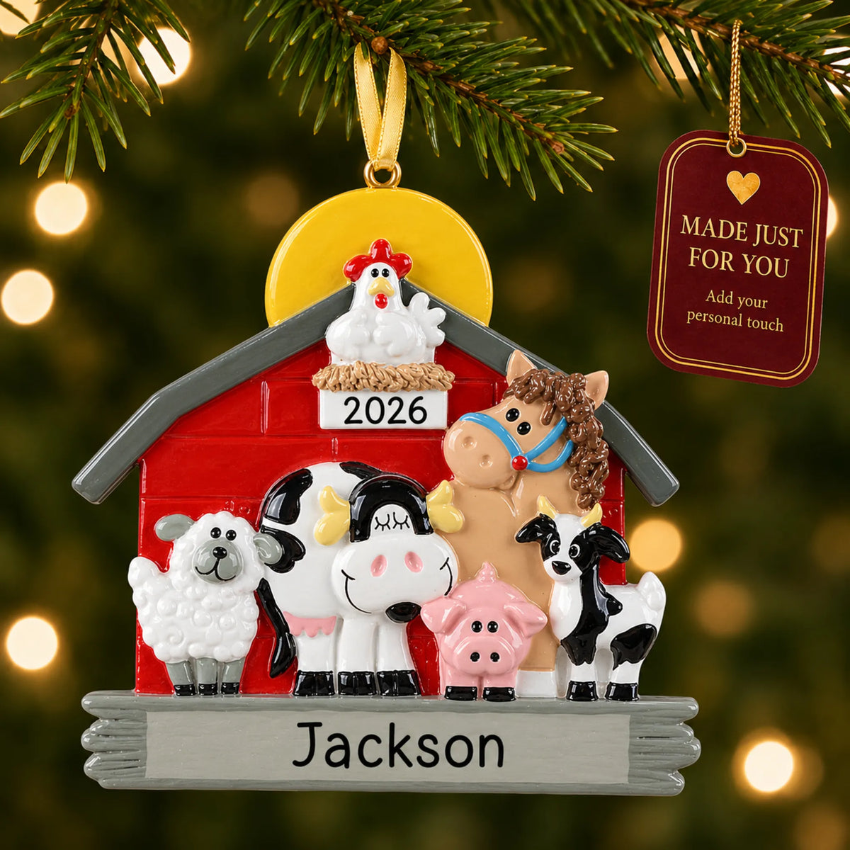 Farm animals barn christmas ornament hanging on a lit Christmas tree with a Made Just For You gift tag