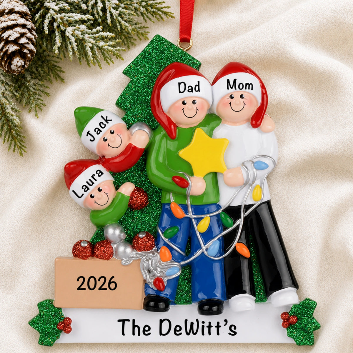 Personalized family of 4 decorating the tree ornament with Dad, Mom, Jack and Laura holding a star